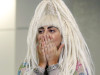 Singer Lady Gaga blows a kiss upon her arrival at Narita international airport