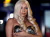 Singer Lady Gaga poses for the media upon her arrival at the Athens' Eleftherios Venizelos airport